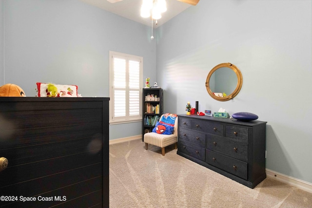 carpeted bedroom with ceiling fan and lofted ceiling