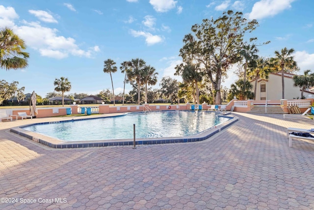 view of pool featuring a patio area