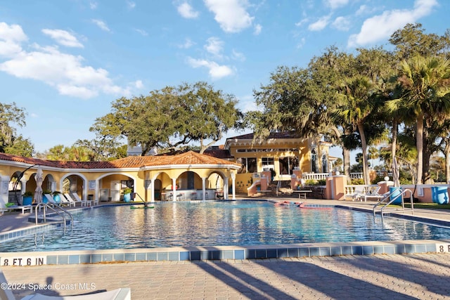 view of swimming pool with a patio