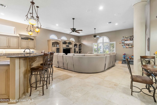 living area featuring visible vents and recessed lighting