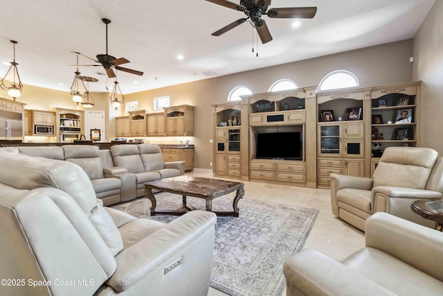 living room with a ceiling fan