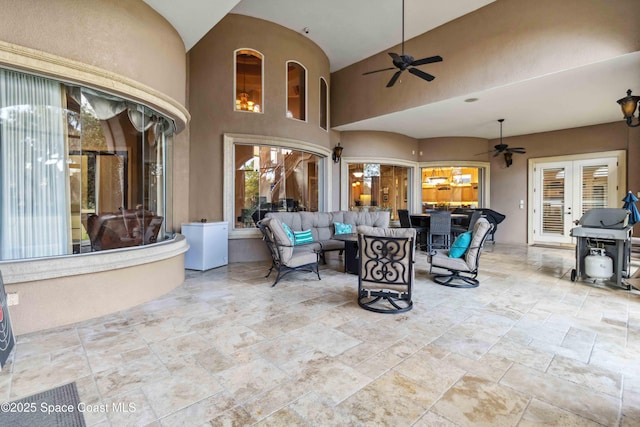 view of patio / terrace with ceiling fan, an outdoor hangout area, area for grilling, and french doors