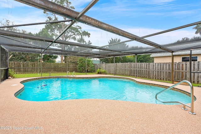 view of swimming pool featuring a lanai and a patio