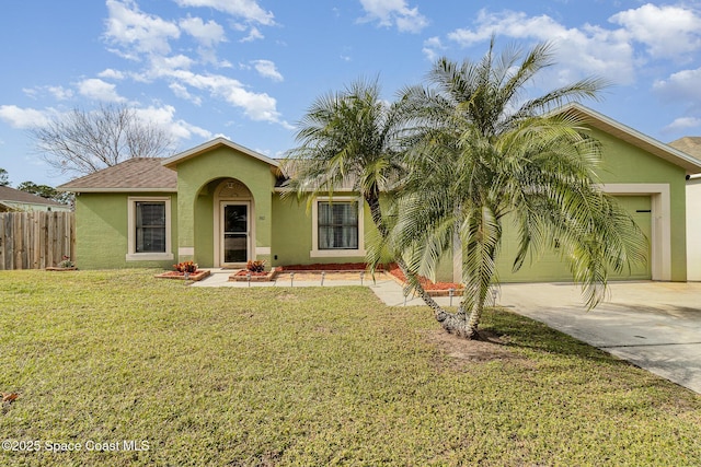 view of front of home with a garage and a front yard