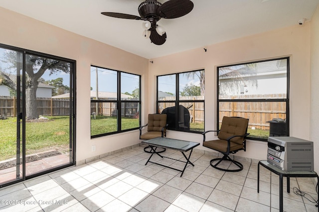 sunroom / solarium with ceiling fan