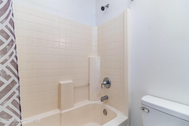 bathroom with toilet and shower / bath combo