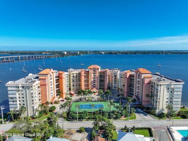 birds eye view of property with a water view