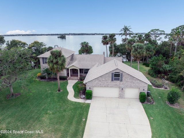 view of front of property with a water view and a front yard