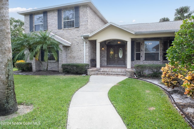 view of front facade with a porch and a front lawn