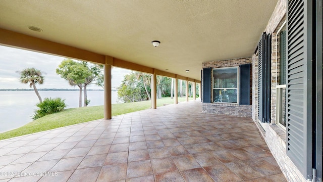 view of patio / terrace featuring a water view