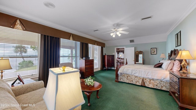 carpeted bedroom with ceiling fan and crown molding