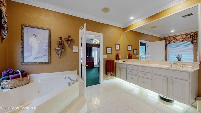 bathroom with tile patterned floors, vanity, ornamental molding, and a bath