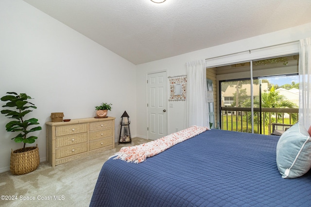 bedroom with a textured ceiling, carpet floors, access to outside, and lofted ceiling