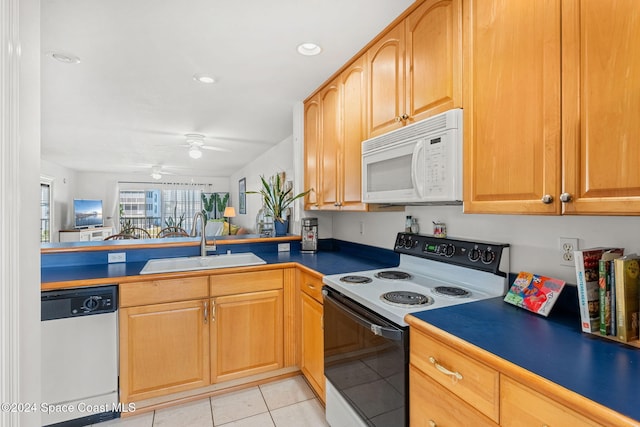 kitchen featuring light tile patterned floors, white appliances, ceiling fan, and sink