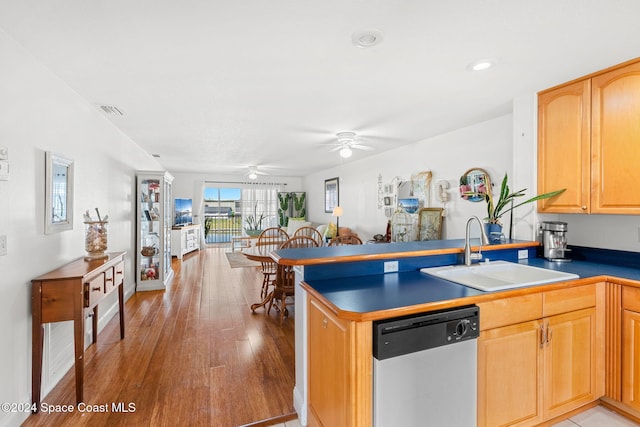 kitchen with sink, light hardwood / wood-style flooring, stainless steel dishwasher, ceiling fan, and kitchen peninsula