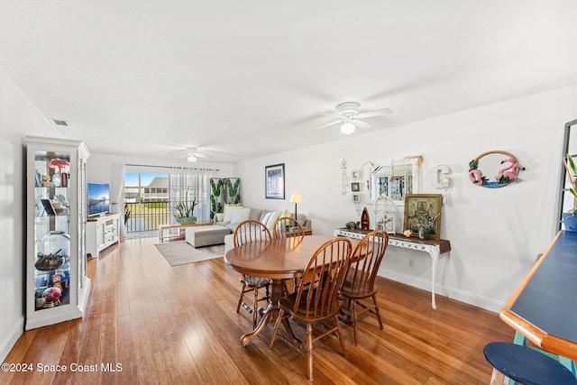 dining room featuring hardwood / wood-style flooring and ceiling fan