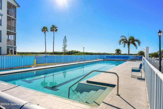 view of swimming pool featuring a patio area