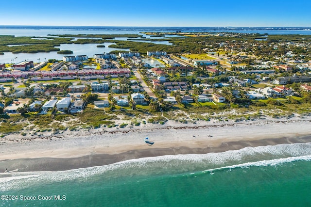 aerial view with a view of the beach and a water view