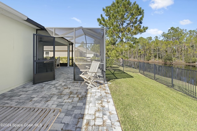 view of yard with a lanai and a patio