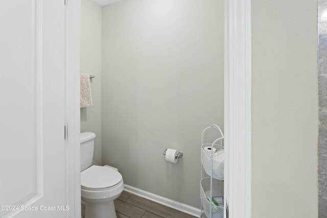 bathroom featuring tile patterned flooring and toilet