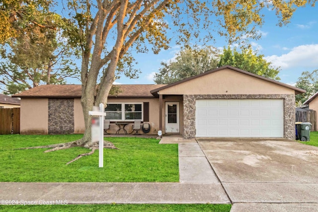 ranch-style house with a garage and a front lawn