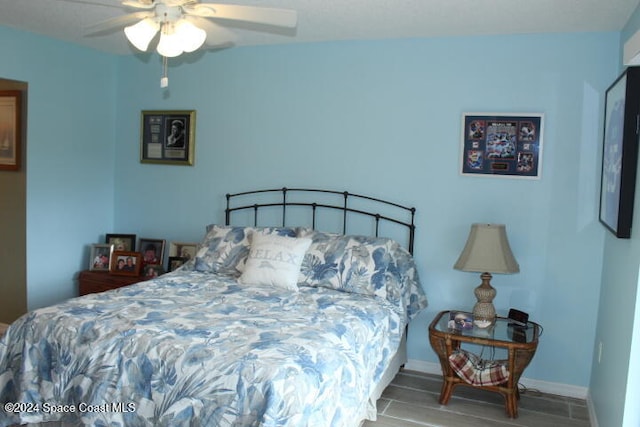 bedroom featuring ceiling fan and wood-type flooring