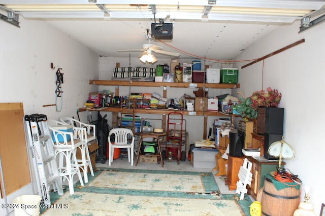 garage with ceiling fan and a garage door opener