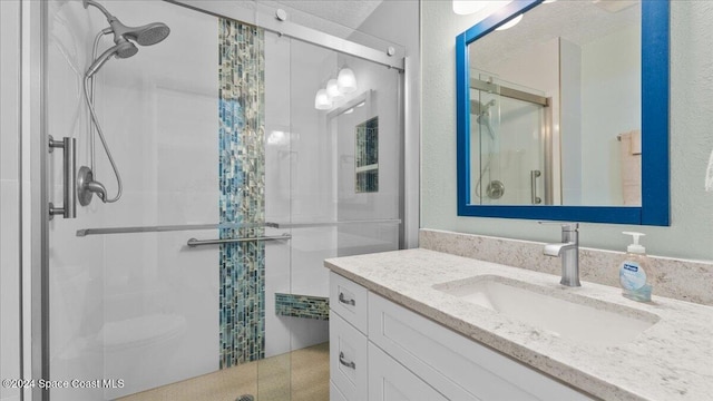 bathroom featuring vanity and walk in shower