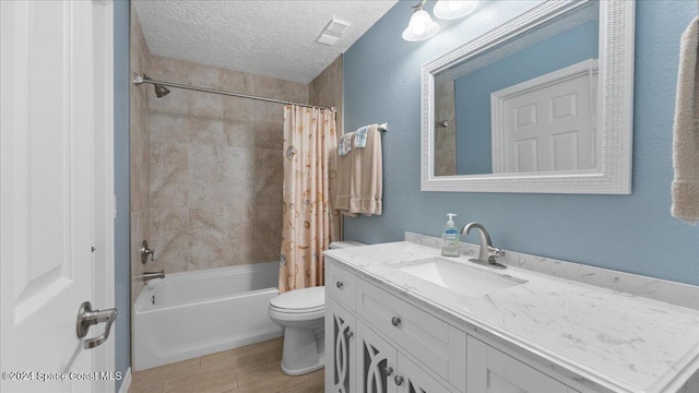 full bathroom featuring vanity, shower / bath combination with curtain, a textured ceiling, and toilet