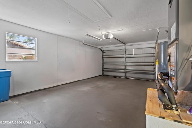 garage featuring a garage door opener and water heater