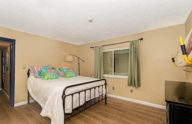 bedroom with hardwood / wood-style floors