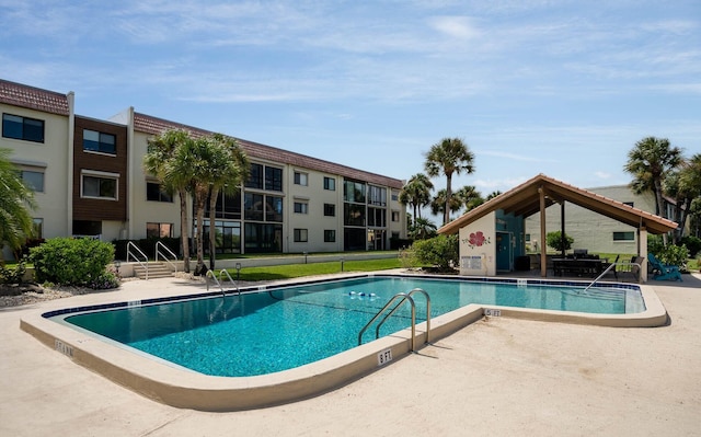 view of swimming pool with a patio area