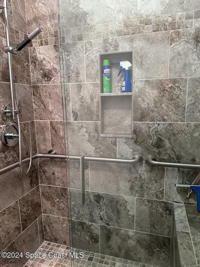 details featuring a tile shower