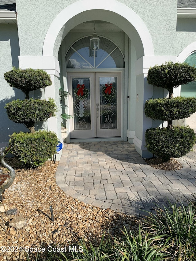 entrance to property featuring french doors