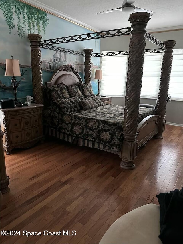 bedroom featuring wood-type flooring and crown molding