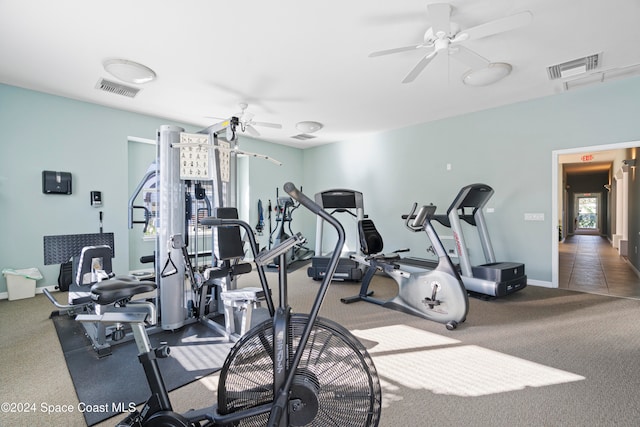 exercise room with carpet and ceiling fan