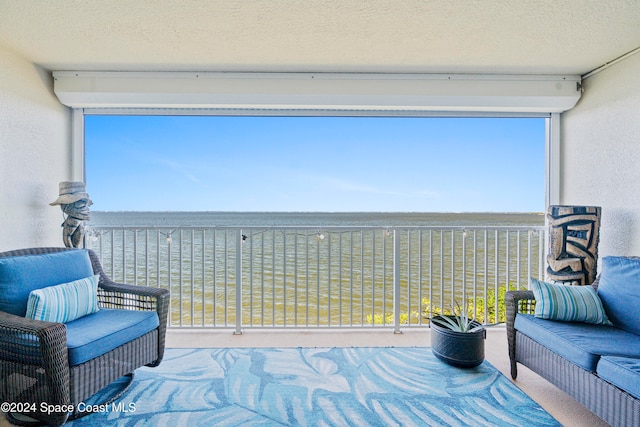 balcony featuring a water view