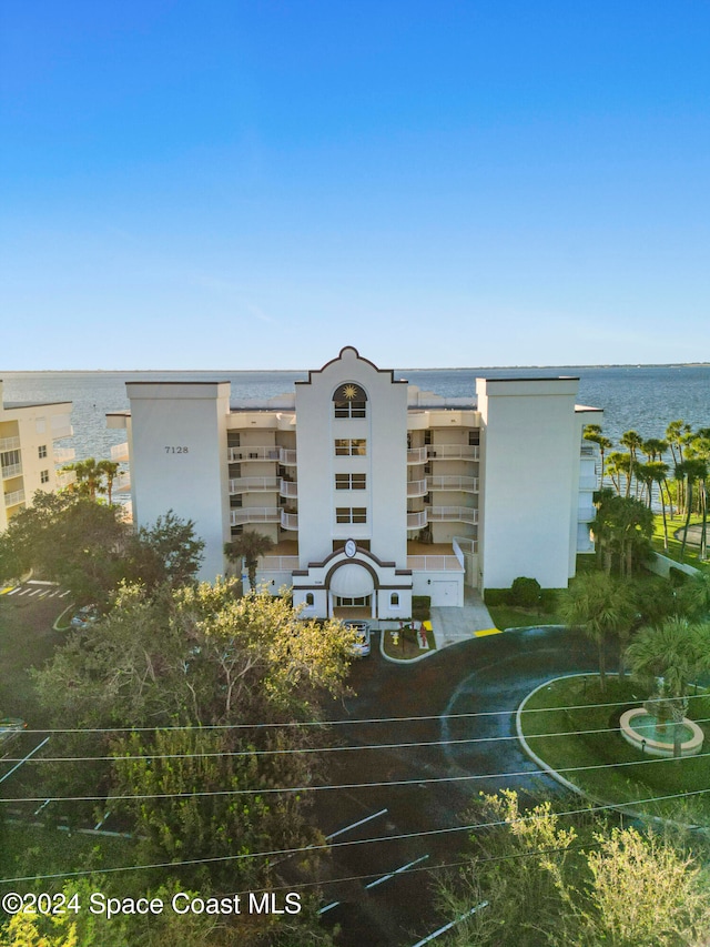 view of building exterior with a water view