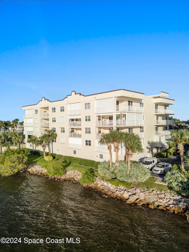 view of property with a water view