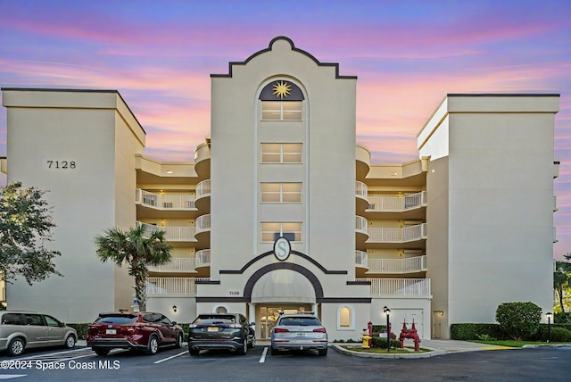 view of outdoor building at dusk