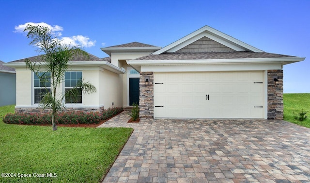 1654 Middlebury Dr SE, Palm Bay, FL 32909 - view of front of home with stone siding, driveway, stucco siding, and a front yard