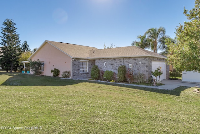 single story home with an attached garage, brick siding, driveway, and a front yard