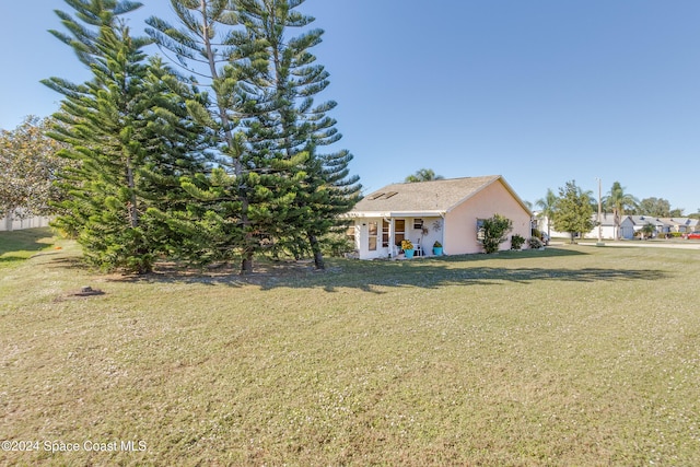 exterior space featuring a front lawn