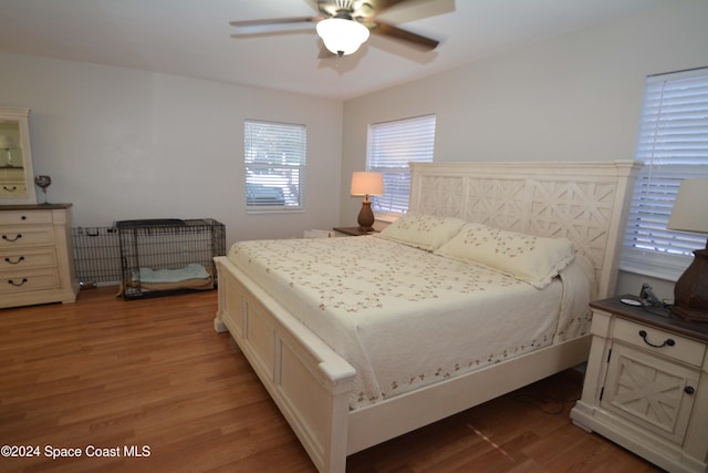 bedroom featuring ceiling fan and hardwood / wood-style flooring