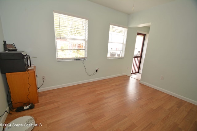 spare room with light wood-type flooring