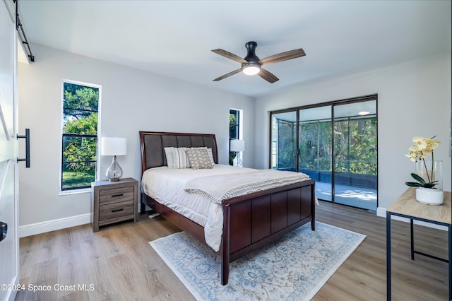 bedroom featuring ceiling fan, access to exterior, and light hardwood / wood-style flooring