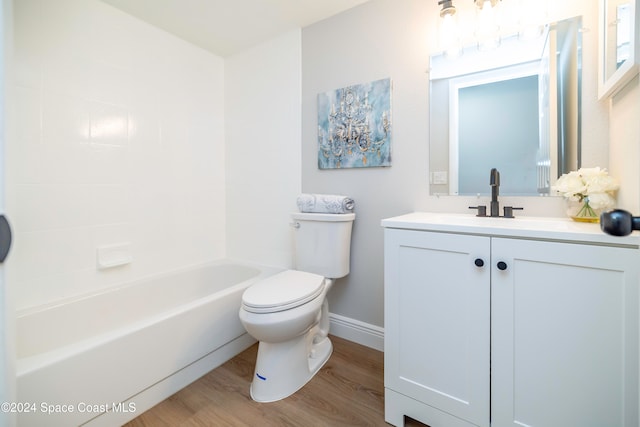 full bathroom featuring bathtub / shower combination, vanity, hardwood / wood-style flooring, and toilet