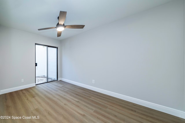 spare room featuring ceiling fan and light hardwood / wood-style floors