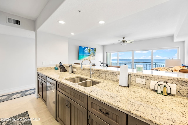 kitchen featuring ceiling fan, dishwasher, sink, and a wealth of natural light