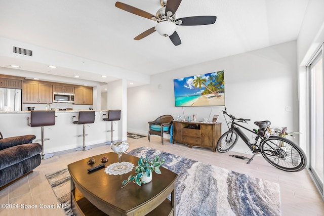 living room with ceiling fan